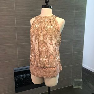 Beautiful, print top with beaded detail.